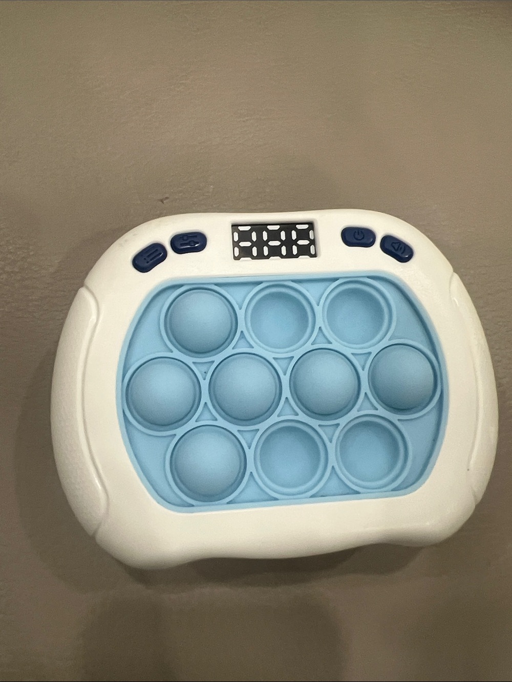Kids Blue and White Sensory Pop Fidget Toy either the timer